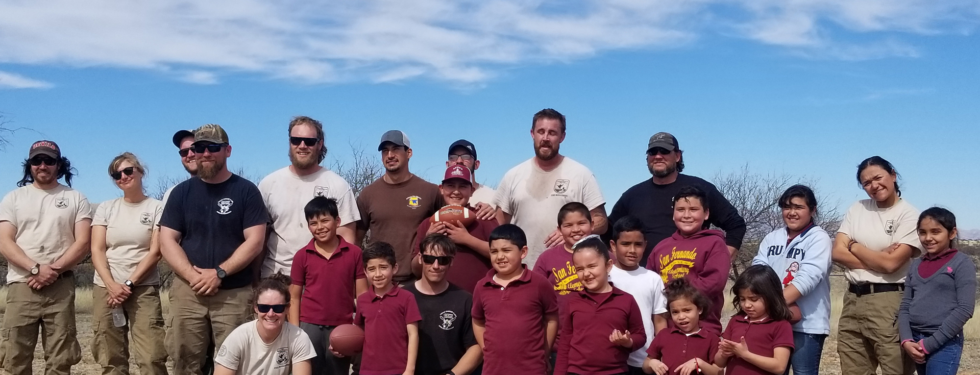 group of students and adults smiling