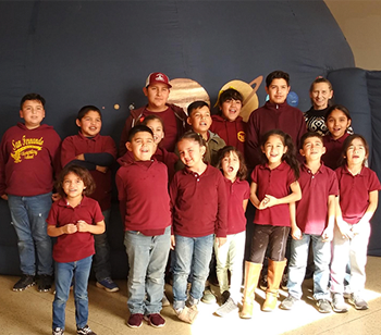 group of students in red shirts